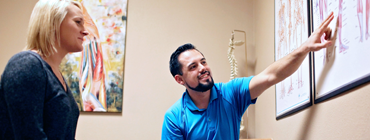 Contact us | Jake Salaz, D.C., M.S., with a patient at Mt. Hood Chiropractic